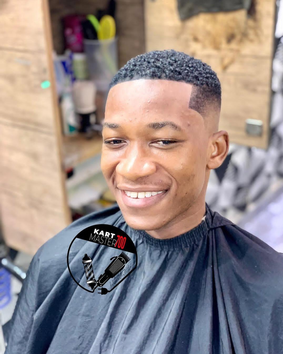 Clean skin fade haircut by Kart Master 700 Accra